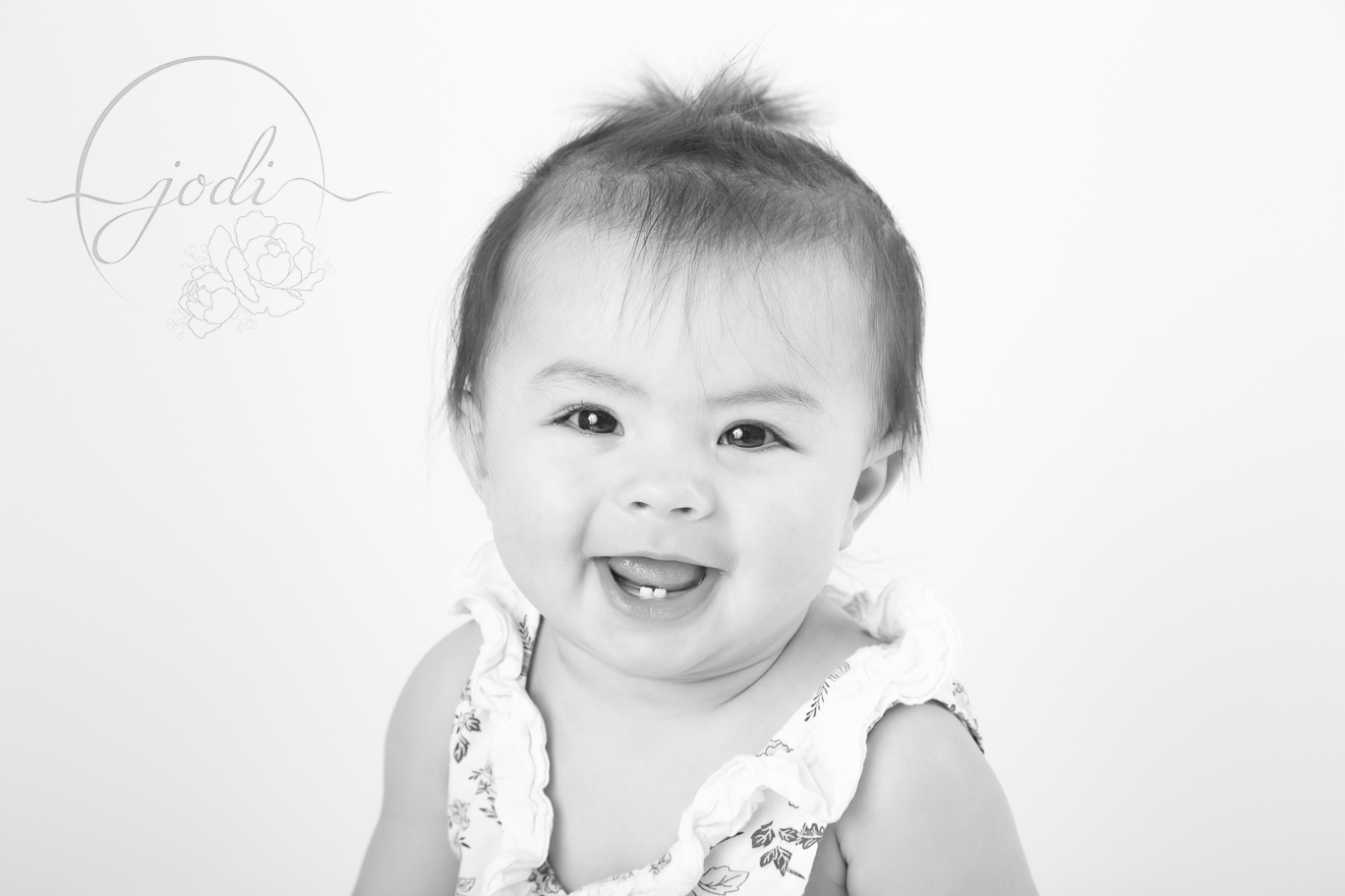 Sharing blog posts of little smiling face by Calgary Photographers
